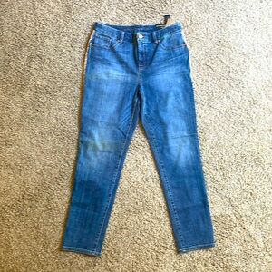 Chico’s So Slimming Girlfriend Ankle Jeans w/ gold glitter trim down sides.